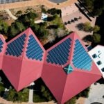 a group of buildings with red roofs